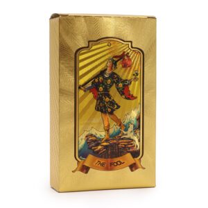 Caja de cartas de tarot doradas con diseño místico y acabado de lujo.